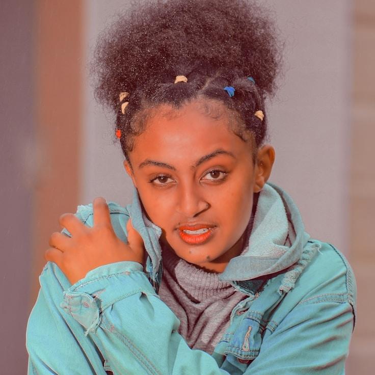 Kaveri Mehta, Lead Design Curator at MeadowLanePoint, reviewing corporate floral arrangements